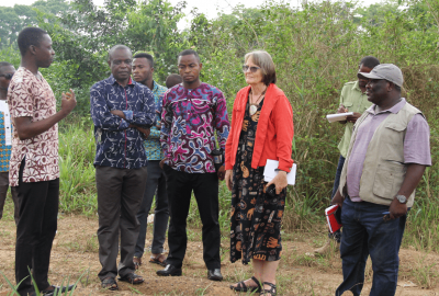 A group of people taking a tour of the farm